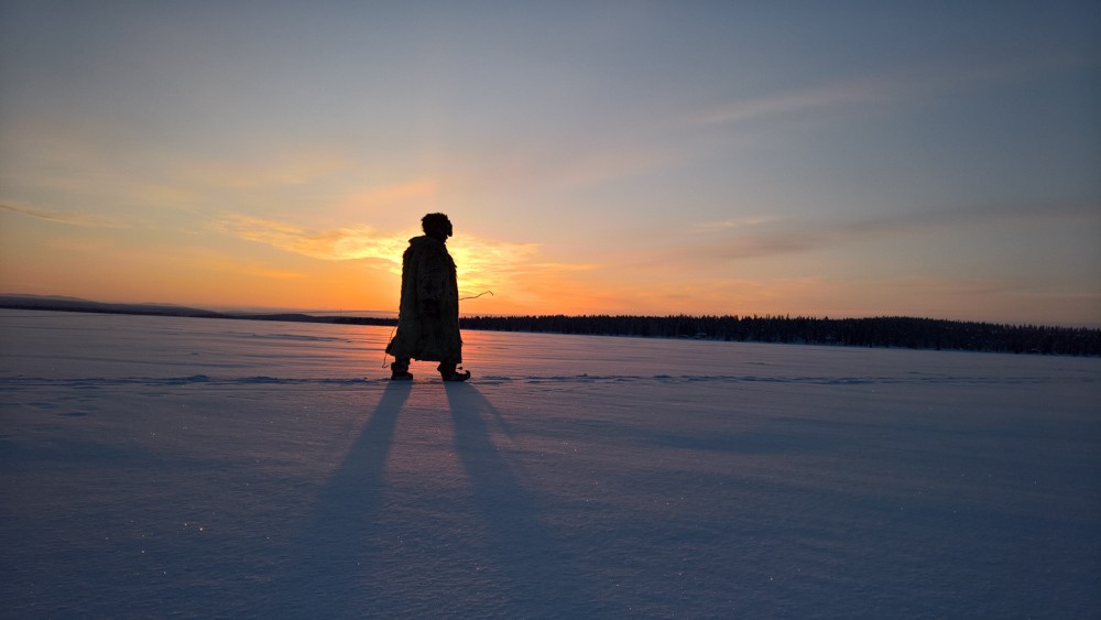 Jari Rorn a Lapland Shaman on the lake near his home in Keimioniementie, FInland. He has spent his life in this landscape. Hunting, fishing, understanding the extreme north. It is more than 35 degrees below zero when this picture was made. Even cold for Jari...